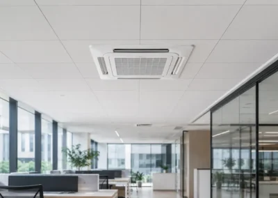 Ceiling-mounted cassette air conditioner unit in a modern commercial office
