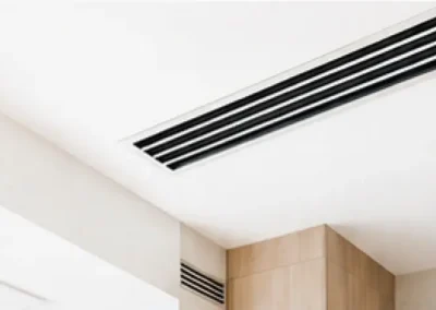 Linear air conditioning vent integrated into a modern ceiling